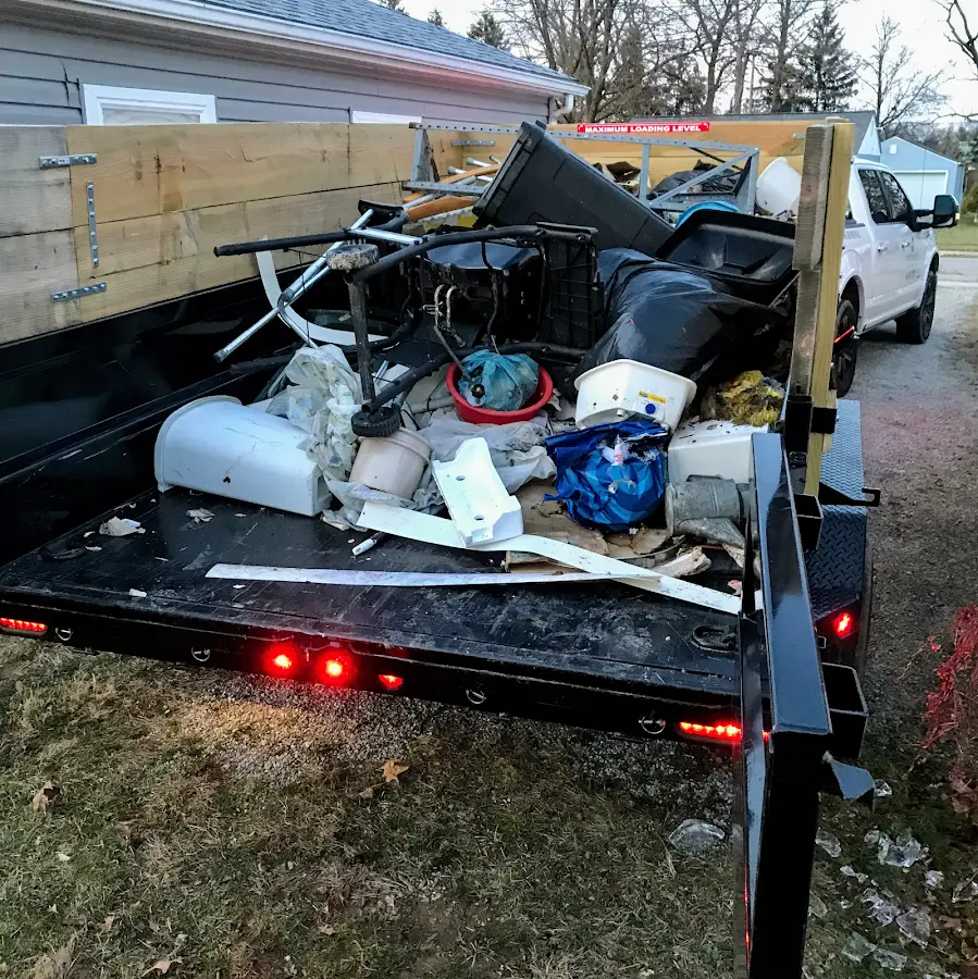Roll-off dumpster delivered to a residential driveway in Dannemora